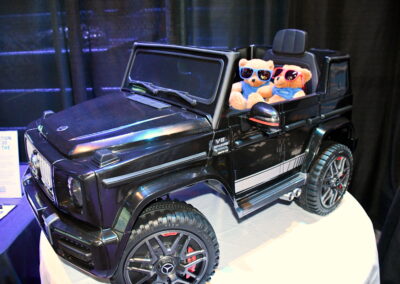 A four wheeler with two teddy bears inside for an auction item