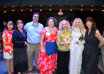 A group of adults smiling for the camera