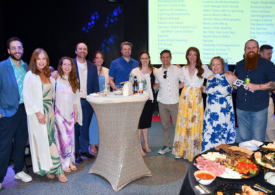 A group of adults smiling for the camera at the gala